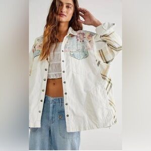 We the free. White jacket with Green and Yellow Floral Accents